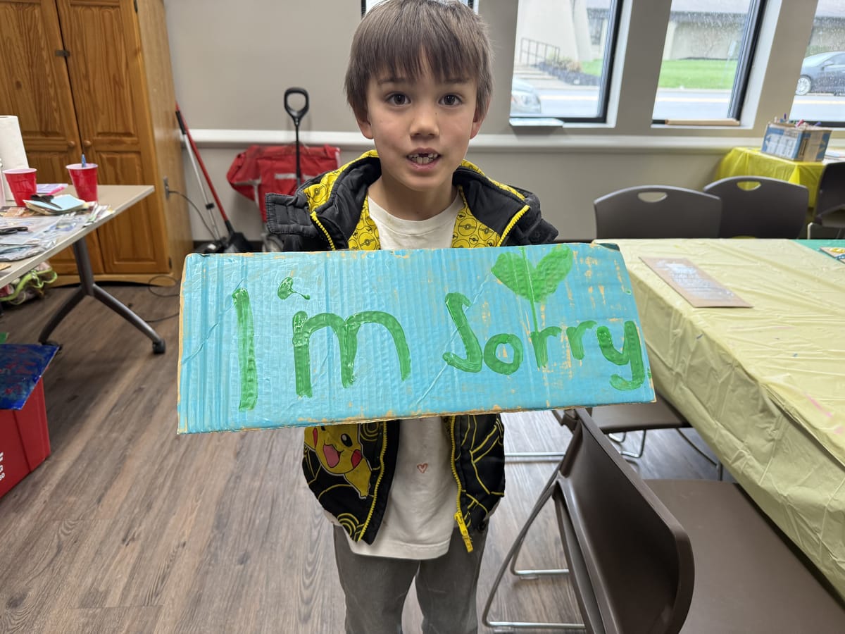 Families rally to support fired Community School teachers, frustrated by Board of Ed's lack of transparency